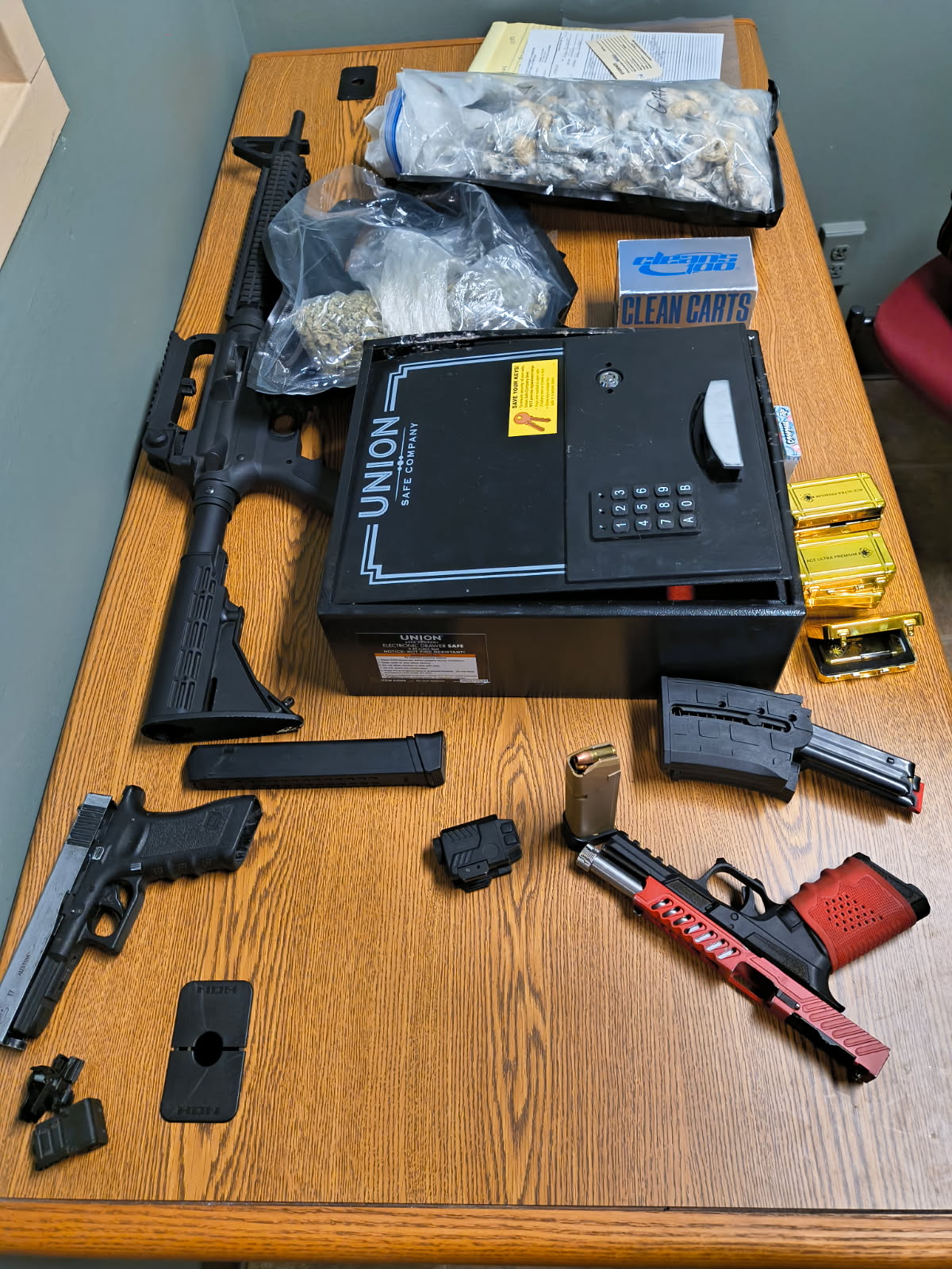Evidence: guns, drugs, pistol magazines, and ammo